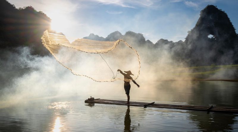 7. fisherman doing fishing with net